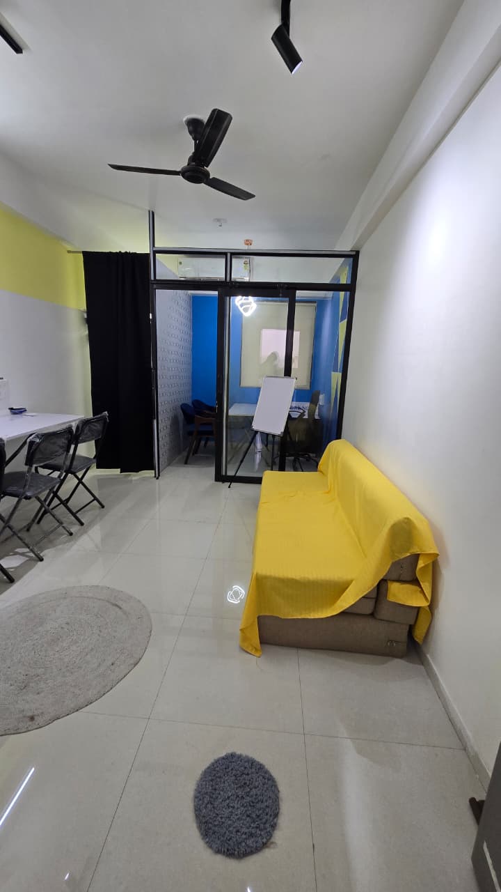 Yellow sofa in open workspace area